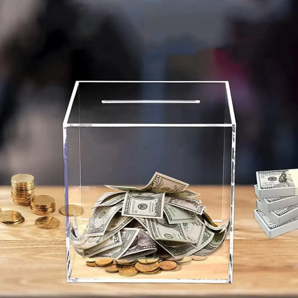 Clear acrylic money saving box with transparent walls and coin slot - front view