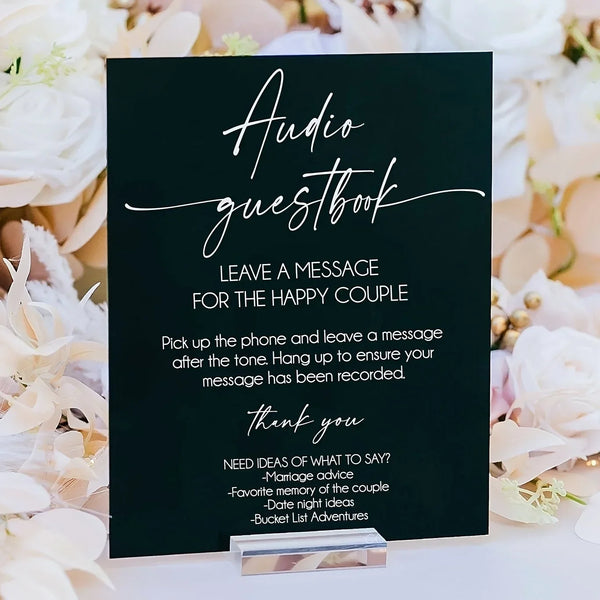 Crystal clear acrylic wedding audio guestbook sign featuring elegant black calligraphy font with phone instructions