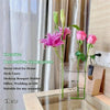 Clear acrylic vase on office desk with minimalist workspace decor