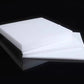 Custom-cut PTFE sheet sample with drilled holes and smooth finish