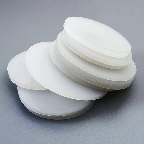 Flexible white silicone gasket demonstrating elasticity and compression resistance