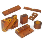 Precision CNC-machined orange and brown phenolic plastic parts including blocks spacers and custom-shaped components for electrical and industrial equipment