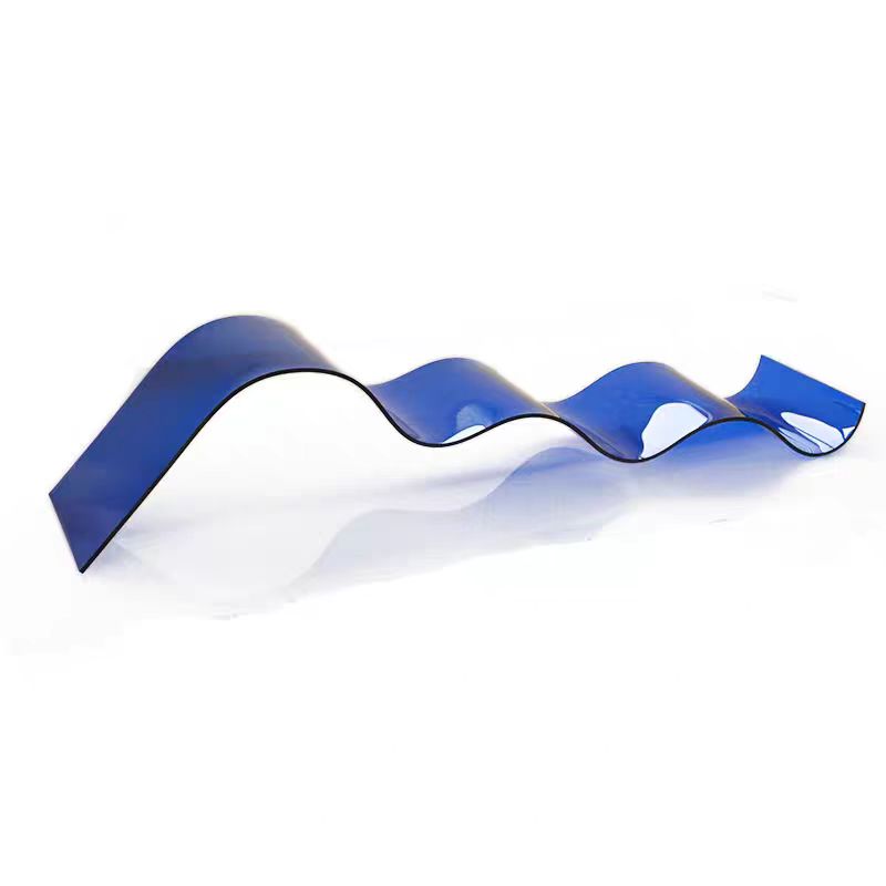 Blue curved plastic part demonstrating precision bending and heat-forming fabrication capabilities