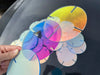 Iridescent acrylic disc with rainbow color shifting effect and LED base slot for DIY lighting projects