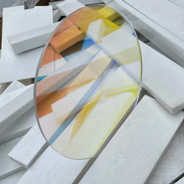 Modern office interior with iridescent acrylic circle wall art creating architectural feature