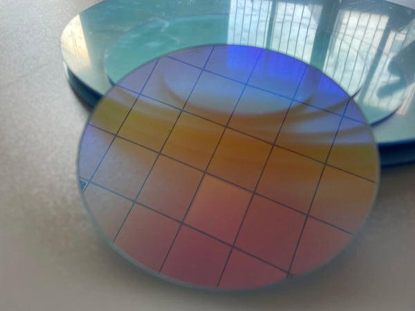 Wedding event decoration featuring suspended iridescent acrylic circles