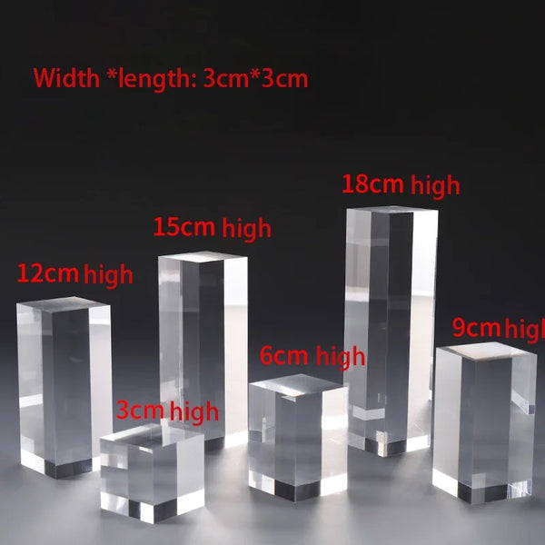 Multiple lipsticks organized on tall acrylic cube display holders