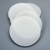 Multiple sizes of white round silicone gasket pads displayed in size order