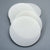 Multiple sizes of white round silicone gasket pads displayed in size order