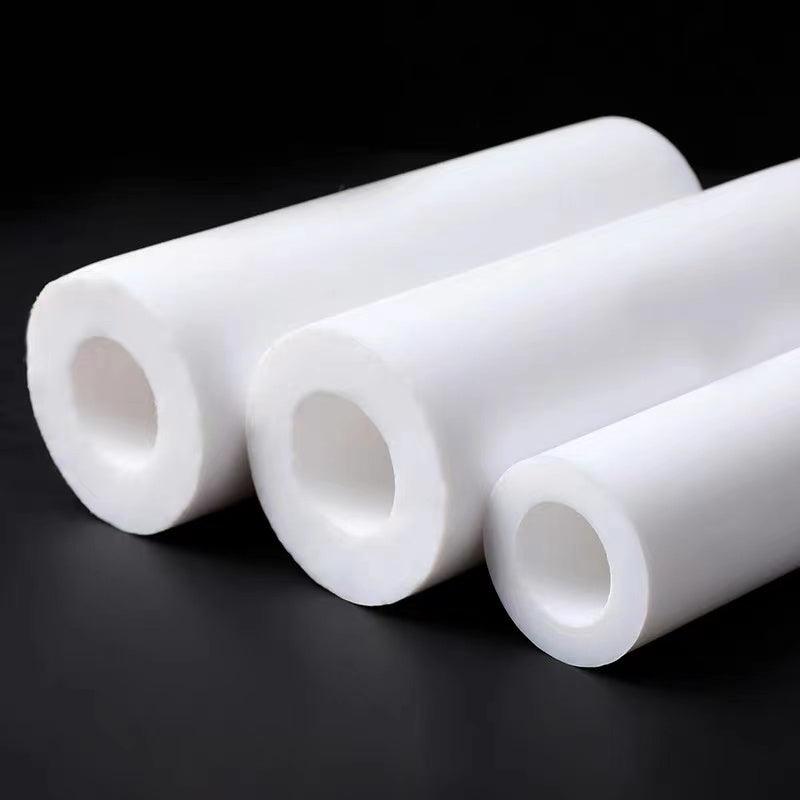 PTFE rod being cut on CNC machine