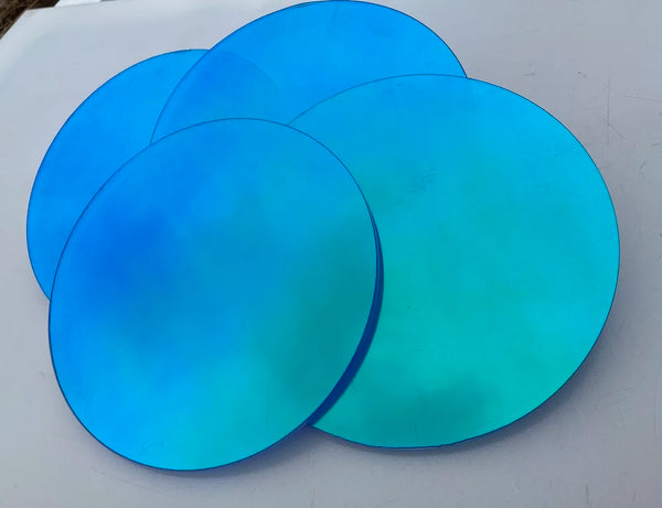 Hotel lobby design with suspended iridescent acrylic circles creating luxury atmosphere