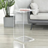 Clear acrylic side table used in compact living space