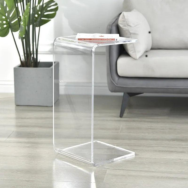Clear acrylic side table used in compact living space