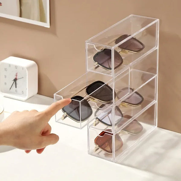 Stackable eyewear storage box on bedroom vanity with transparent design