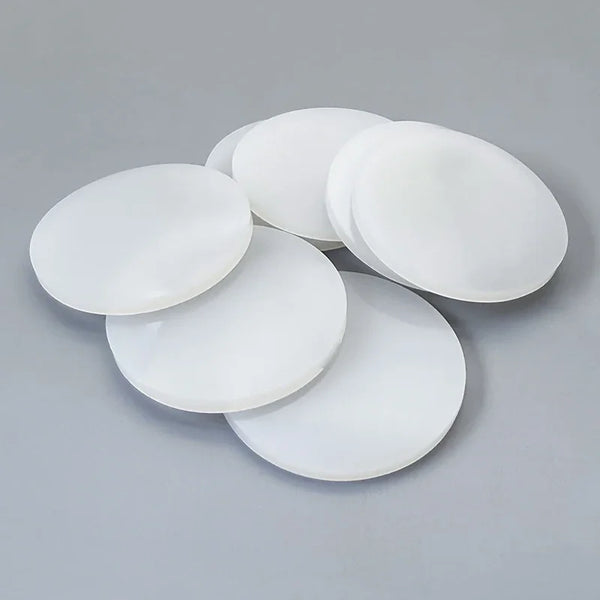 Close-up view of smooth white silicone rubber gasket surface showing precision cut edge