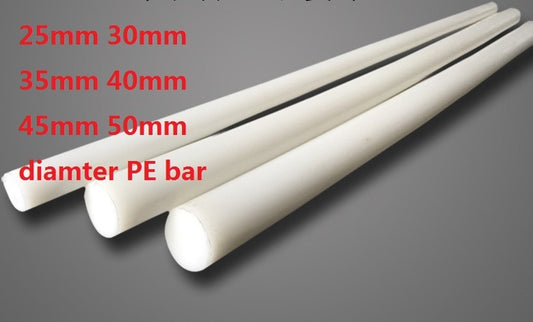 White 1 inch diameter HDPE plastic rod on a ruler